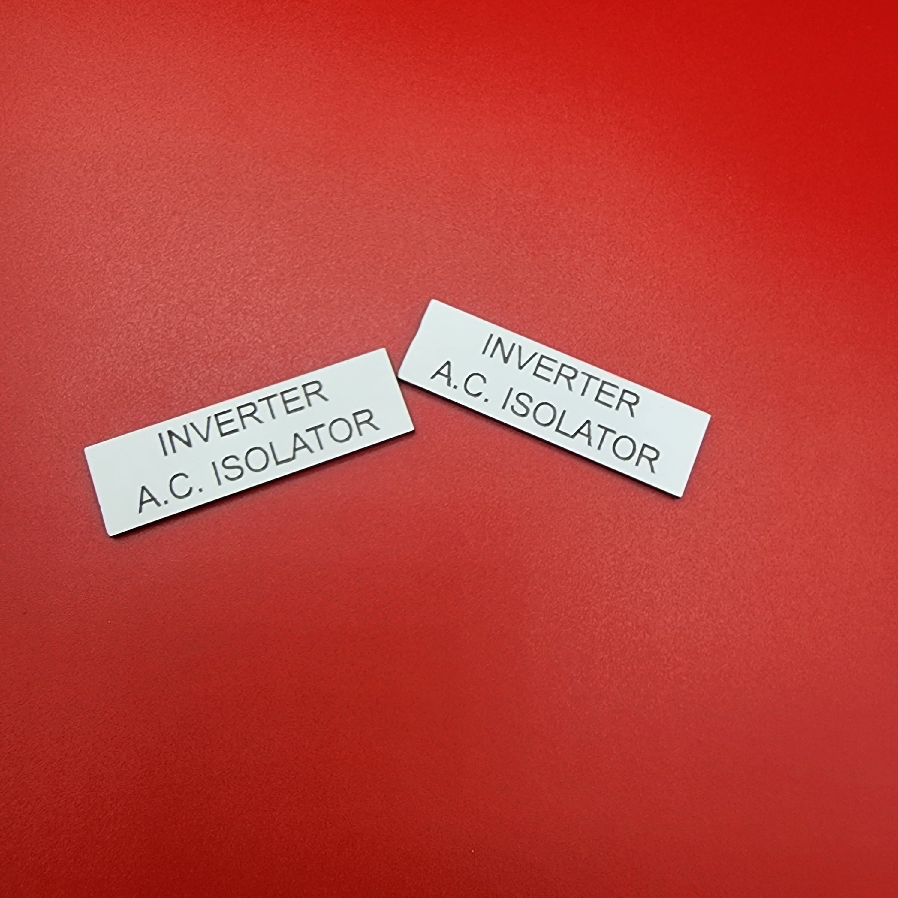 Pair of identification labels showing consistent engraving quality