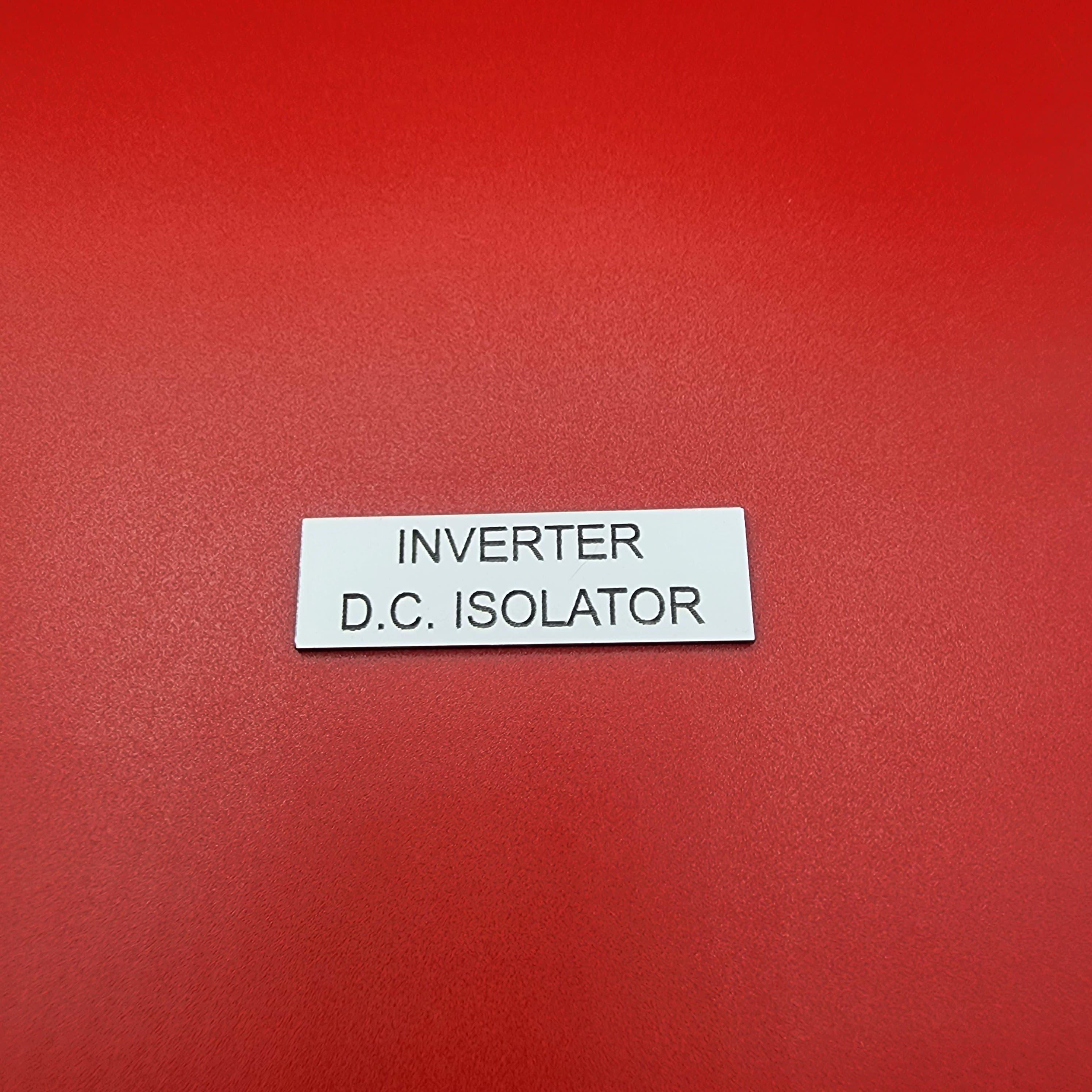 DC isolator label — identifies the cable behind the isolator